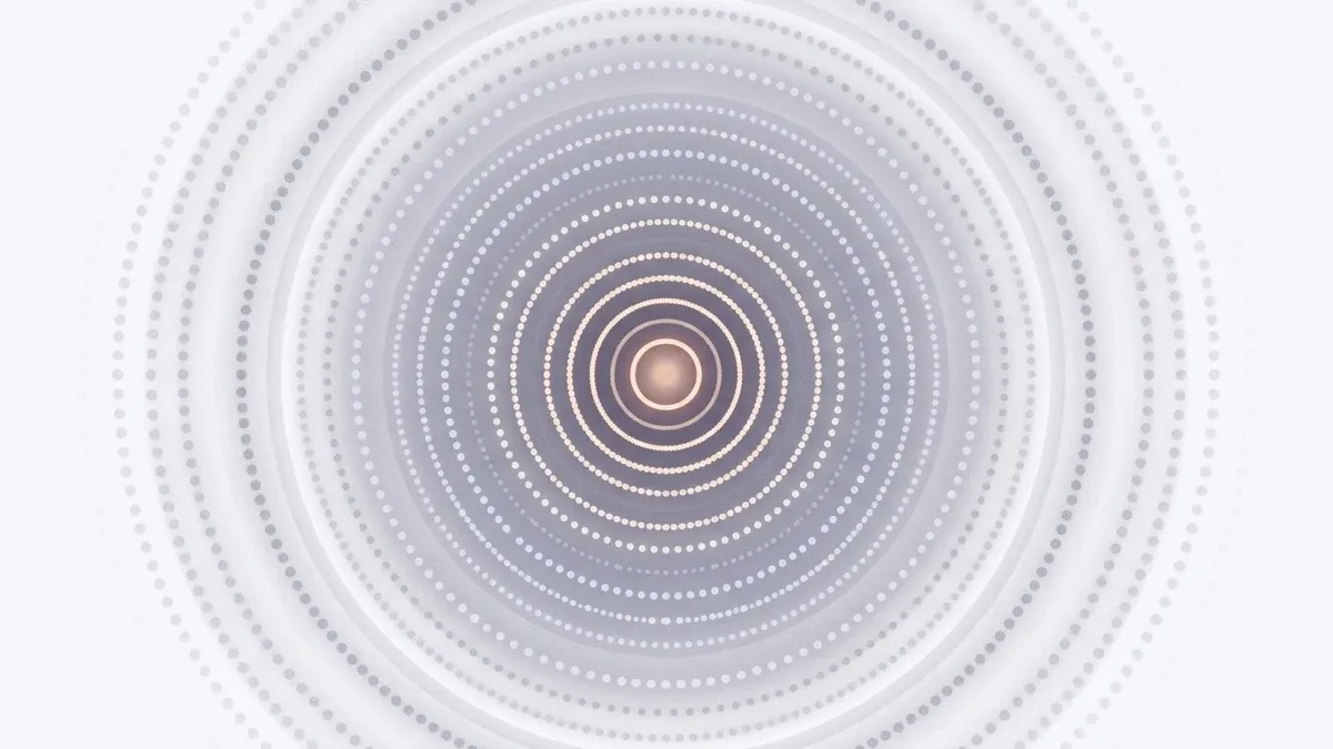 A concentric diagram of many rings of dots narrowing inward, the outer rings faded grey and a small warm glowing core at the centre, representing how survival mode narrows life down to bare essentials.